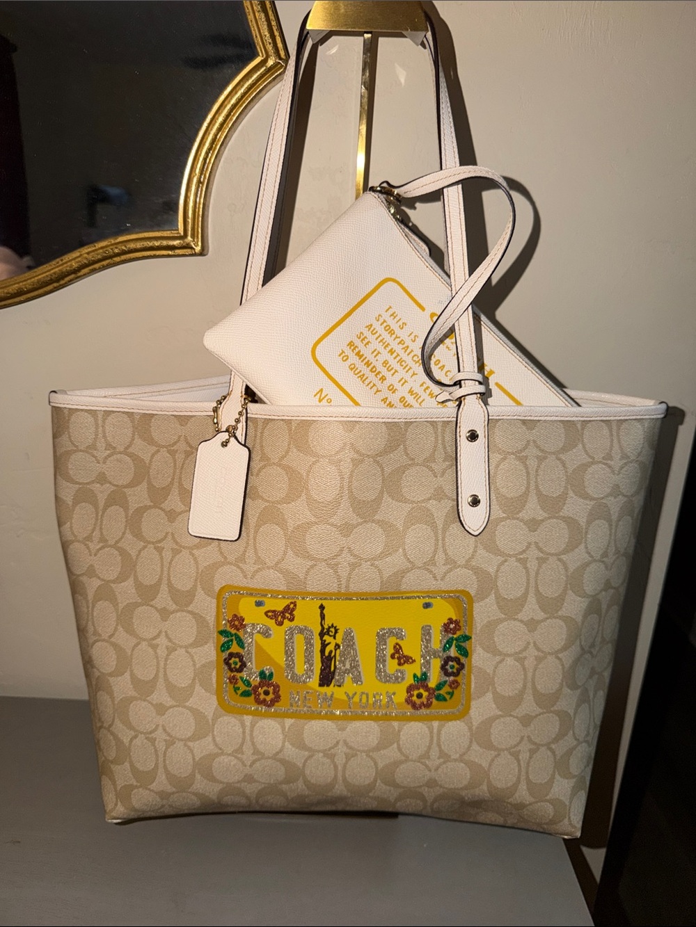 Coach Beige Signature Canvas Tote with Yellow Floral Patch